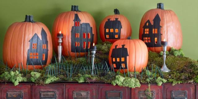 Carved Pumpkins, Smiling, on a Table Out of Doors Facing and Side