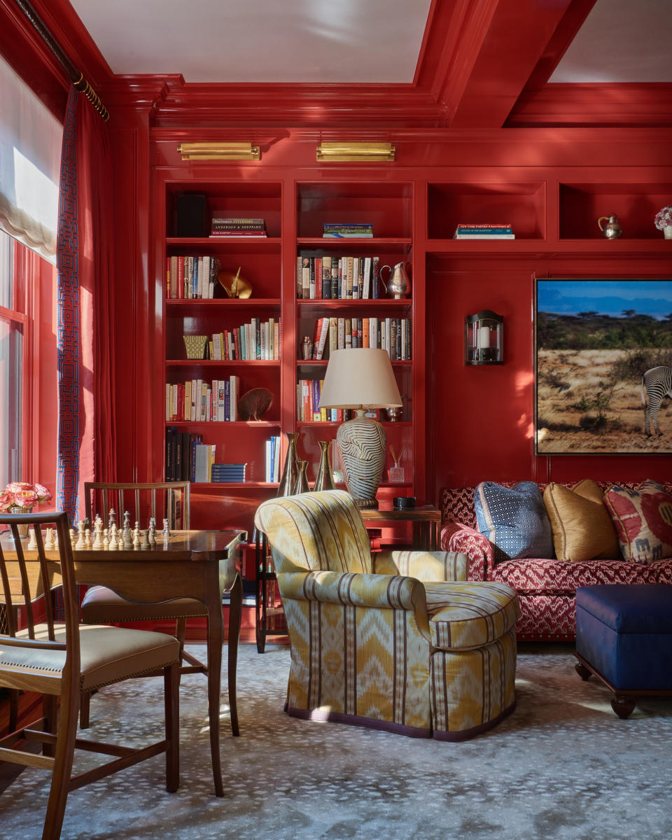 <p> When it comes to choosing living room color ideas don&apos;t be timid say the experts. &apos;Stop playing it safe, and choose colors you love and bring you joy,&apos; advises the New York based interior designer Phillip Thomas. &apos;In one of my favorite living rooms, we used Benjamin Moore&apos;s Ladybug Red to create a super vibrant space with a strong personality.&apos;&#xA0; </p> <p> Warm and bold, the vibrant red shade helps balance the strong architectural lines of this space, but also makes a wonderful backdrop for patterned fabrics and bold artwork.&#xA0; </p> <p> &apos;I also love layer artwork, whether that means creating a gallery wall of prints and photographs, putting a framed painting next to shelves of small sculptures, or creating a dialogue with architectural elements, such as hanging art over a bookshelf or propping it up against a column,&apos; adds Phillip Thomas. </p>