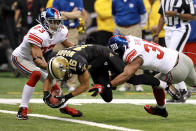 NEW ORLEANS, LA - NOVEMBER 28: Wide receiver Lance Moore #16 of the New Orleans Saints dives into the endzone to score on a 10-yard touchdown reception against Corey Webster #23 and Deon Grant #34 of the New York Giants in the second quarter at Mercedes-Benz Superdome on November 28, 2011 in New Orleans, Louisiana. (Photo by Ronald Martinez/Getty Images)
