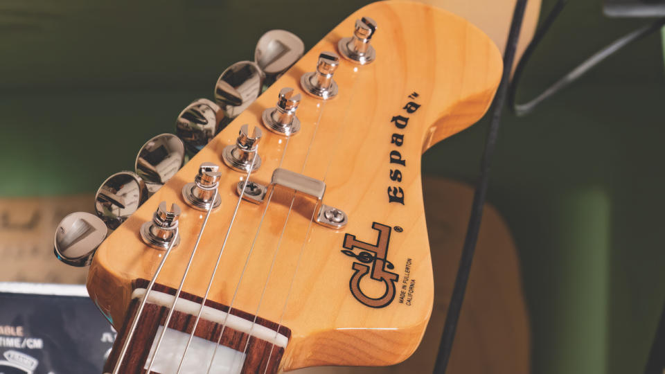 The headstock of an Espada HH guitar