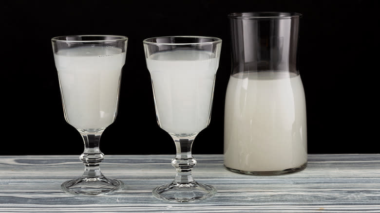 glasses and carafe of palm wine