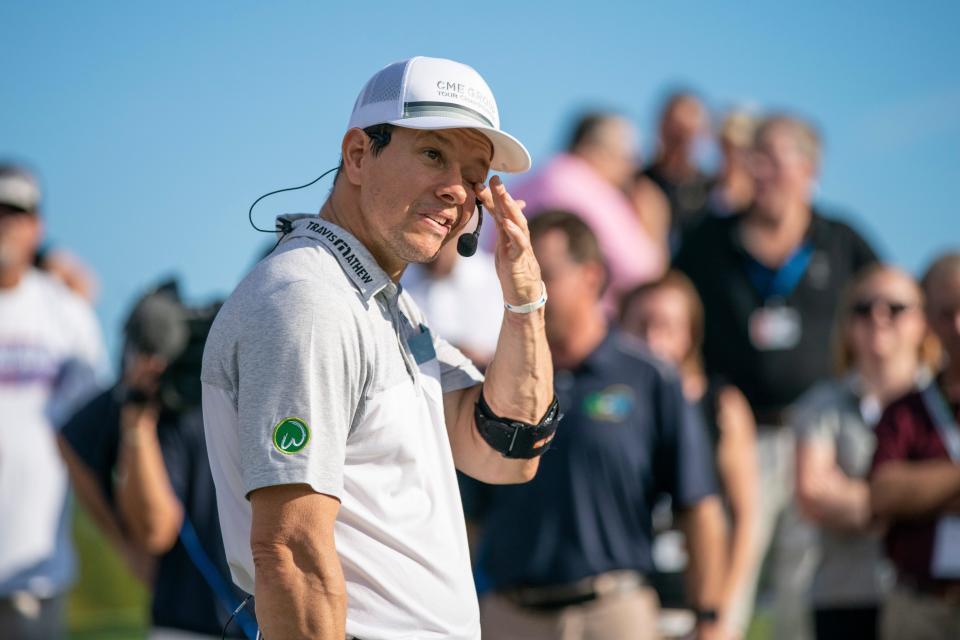 A movie star, Mark Wahlberg wipes sweat off during CME Group's a closest to the pin contest for their customers. The customers will pay $1,000 each, which will all go to charity at Tiburón Golf Club at Wednesday, Nov. 14, 2018. The contest brought $52,000 and Mark Wahlberg matched the amount to raise $104,000 for St. Jude Chidlren's Hospital.