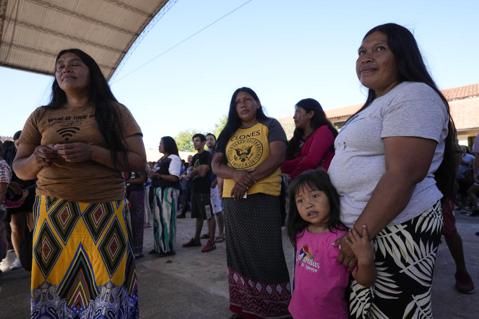 Maka Indigenous people line up at a polling station during general elections in Mariano Roque Alonso, outskirts Asuncion, Paraguay, Sunday, April 30, 2023. (AP Photo/Jorge Saenz)