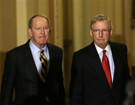 Senate Minority Leader Mitch McConnell (R-KY) (R) and Senator Lamar Alexander (R-TN) (L) walk to a press conference on Capitol Hill in Washington November 21, 2013. REUTERS/Gary Cameron