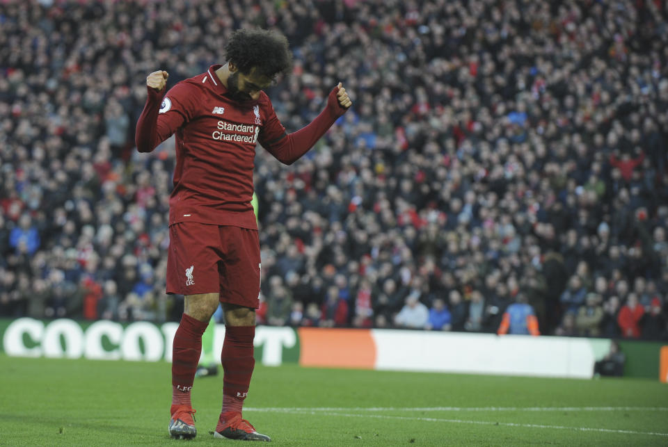 Liverpool's Mohamed Salah celebrates after scoring his side's third goal during the English Premier League soccer match between Liverpool and AFC Bournemouth at Anfield stadium in Liverpool, England, Saturday, Feb. 9, 2019. (AP Photo/Rui Vieira)