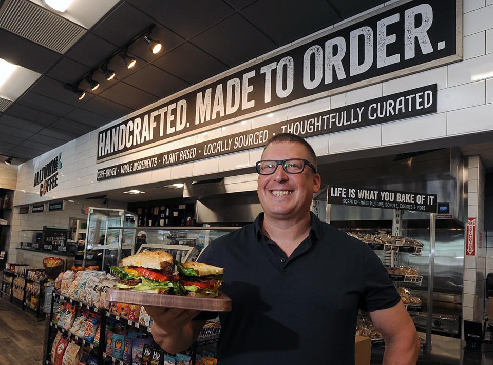 Joshua Smith, vice president at Alltown Fresh,  with a BLT sandwich at the newest Marlborough location at 656 Boston Post Road, June 30, 2021.