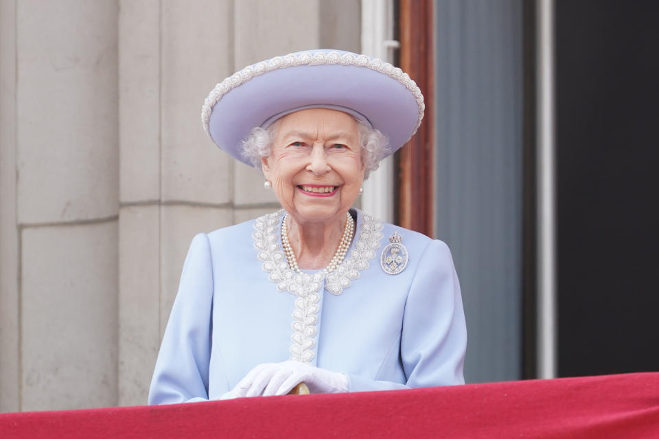 A beaming Queen Elizabeth II watches from the Buckingham Palace balcony during the Trooping the Colour ceremony at Horse Guards Parade. (PA)