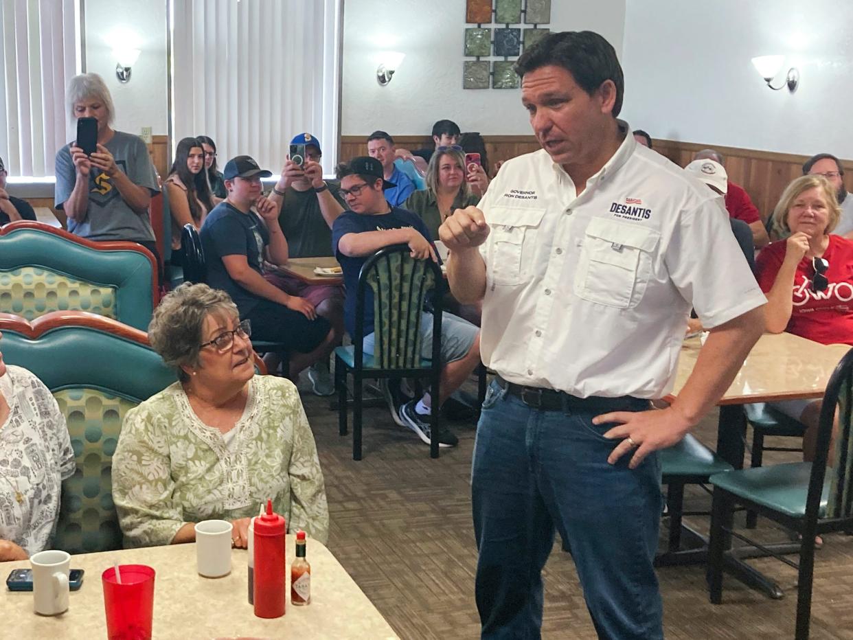 Republican presidential candidate Florida Gov. Ron DeSantis talks with diners at Vinton Family Restaurant in Vinton, Iowa, Saturday, Aug. 5, 2023. DeSantis was on a two-day trip across Iowa.