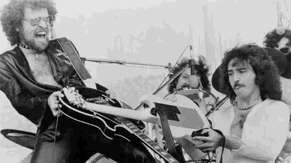 Blue Oyster Cult’s Eric Bloom and Buck Dharma in a guitar duel onstage in the 1970s