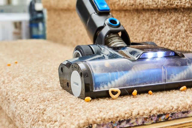 <p>People / Henry Wortock</p> Black and Decker Powerseries Vacuum tackles cereal on carpeted stairs in our testing lab