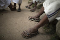 Arhuaco Indigenous men gather in Nabusimake on the Sierra Nevada de Santa Marta, Colombia, Tuesday, Jan. 17, 2023. The knowledge that the Arhuacos and the three other Indigenous peoples of the Sierra Nevada de Santa Marta, the Koguis, Wiwas y Kankuamos, has been declared Intangible Cultural Heritage by UNESCO. (AP Photo/Ivan Valencia)