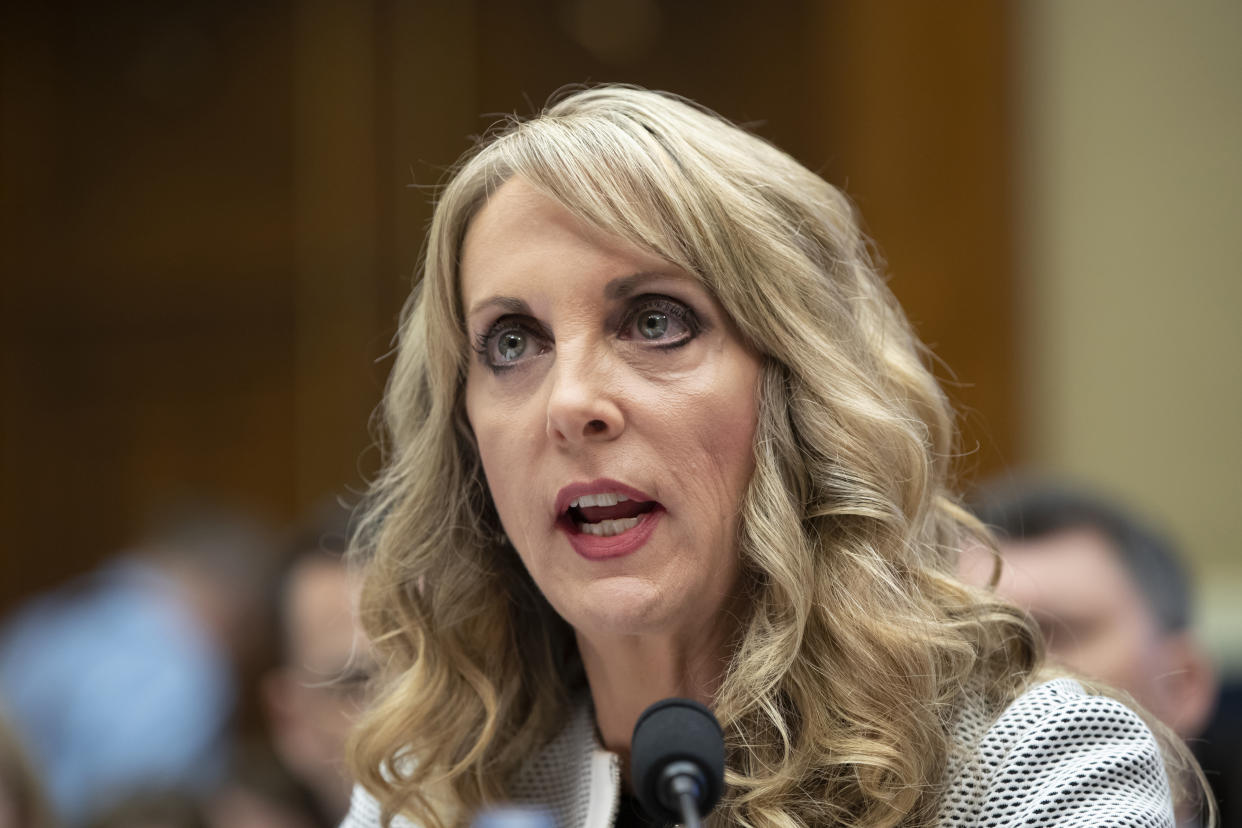 FILE – In this May 23, 2018, file photo, USA Gymnastics President and CEO Kerry Perry testifies before the House Commerce Oversight and Investigations Subcommittee on Capitol Hill in Washington. Kerry Perry has resigned as president of USA Gymnastics. The announcement Tuesday, Sept. 4, 2018, came days after the United States Olympic Committee questioned the direction of the organization under Perry’s leadership.(AP Photo/J. Scott Applewhite, File)