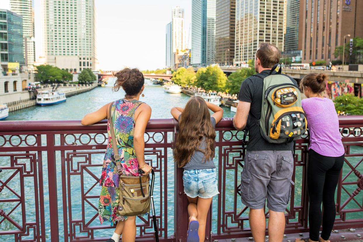 young family looks out over the Chicago River