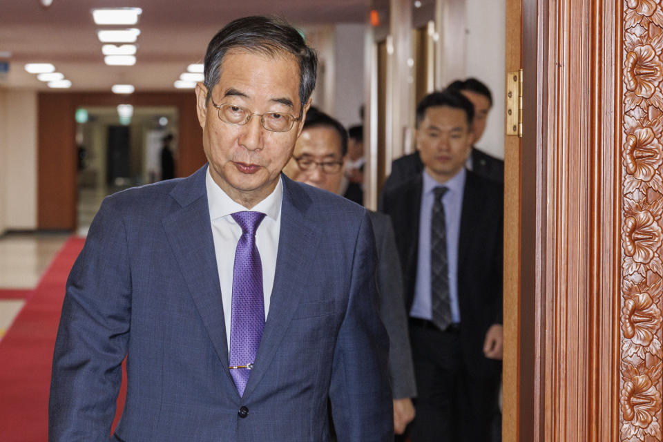 South Korea's Prime Minster Han Duck-soo arrives for a cabinet meeting at the government complex in Seoul, South Korea, Thursday, April 11, 2024. (Hwang Kwang-mo/Yonhap via AP)