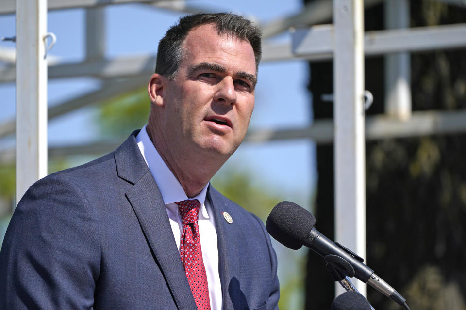 FILE - In this May 7, 2021, file photo, Oklahoma Gov. Kevin Stitt speaks during an Oklahoma Law Enforcement Memorial Ceremony in Oklahoma City. Stitt signed a bill late Tuesday, May 11, 2021, to add one day of early, in-person voting from 8 a.m. to 6 p.m. on the Wednesday before a presidential election. (AP Photo/Sue Ogrocki File)