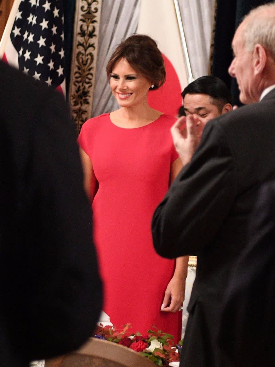 Melania wore a floor-length red gown for the dinner. Photo: Getty