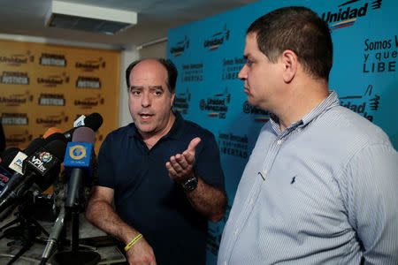 Julio Borges (L), president of the National Assembly and lawmaker of the Venezuelan coalition of opposition parties (MUD) talks to the media during a news conference, next to his fellow lawmaker Luis Florido, in Caracas, Venezuela, September 16, 2017. REUTERS/Marco Bello