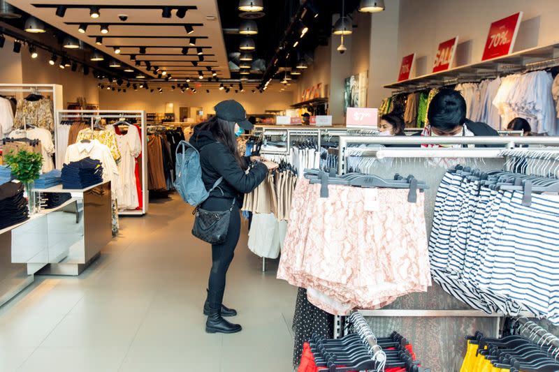 FILE PHOTO: Customers browse at H&M in Toronto during its phased reopening