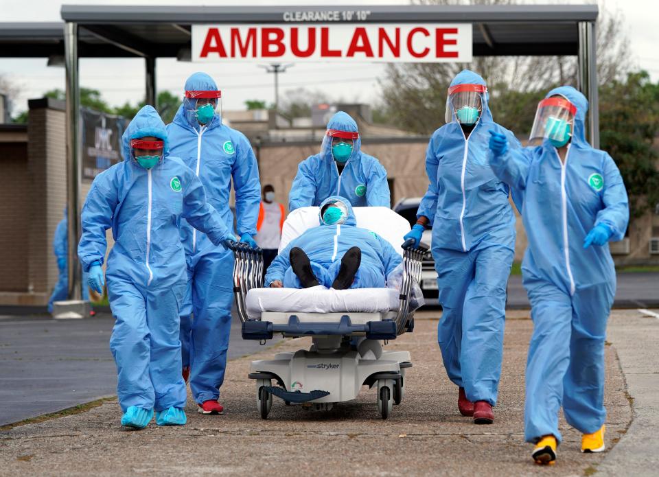 A COVID-19 patient is taken into a hospital on March 19, 2020, in Houston.