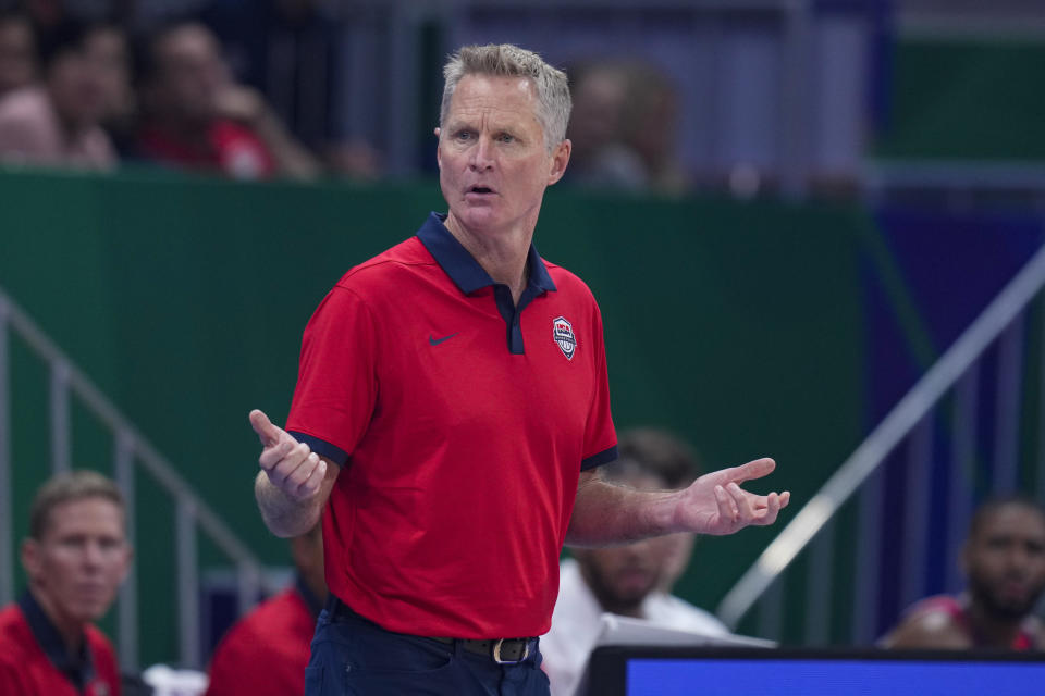 U.S. head coach Steve Kerr questions a call during the first half of a Basketball World Cup group C match against New Zealand in Manila, Saturday, Aug. 26, 2023. (AP Photo/Michael Conroy)