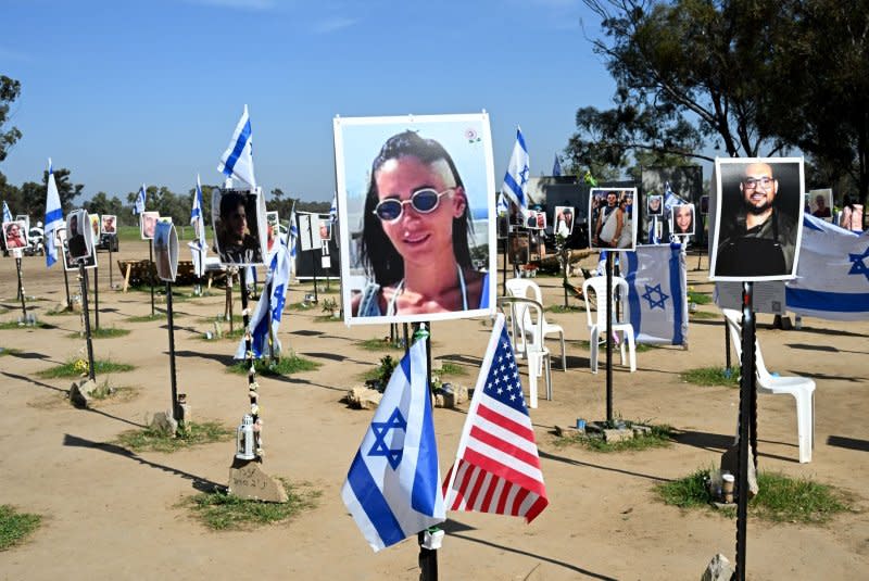 Israeli and American flags hang near portraits of Israelis taken captive or killed by Hamas militants during the October 7 attacks, at the site of the Supernova Music Festival in Reim on January 20. Photo by Debbie Hill/UPI