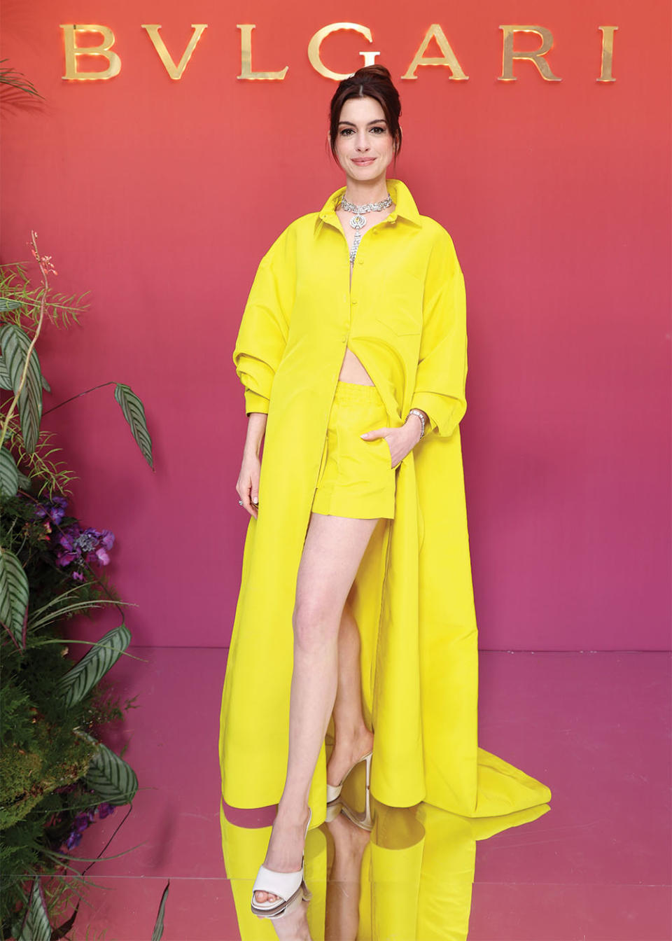 Anne Hathaway stunned in yellow Valentino at the Bulgari Eden the Garden of Wonders event in Paris in June. Her stylist is Erin Walsh.