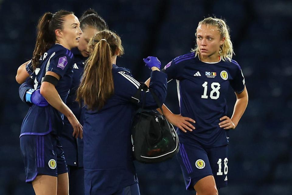Caroline Weir is helped off the pitch at Hampden after suffering an ACL injury  (Getty Images)