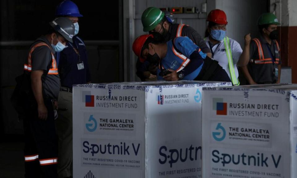 Workers inspect the first batch of Sputnik V vaccines in Guatemala City in May.