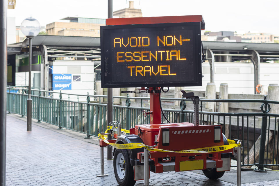 A concept to illustrate the daily impact of the Covid-19 virus on the public as a whole. A static sign displays messaging regarding the pandemic.