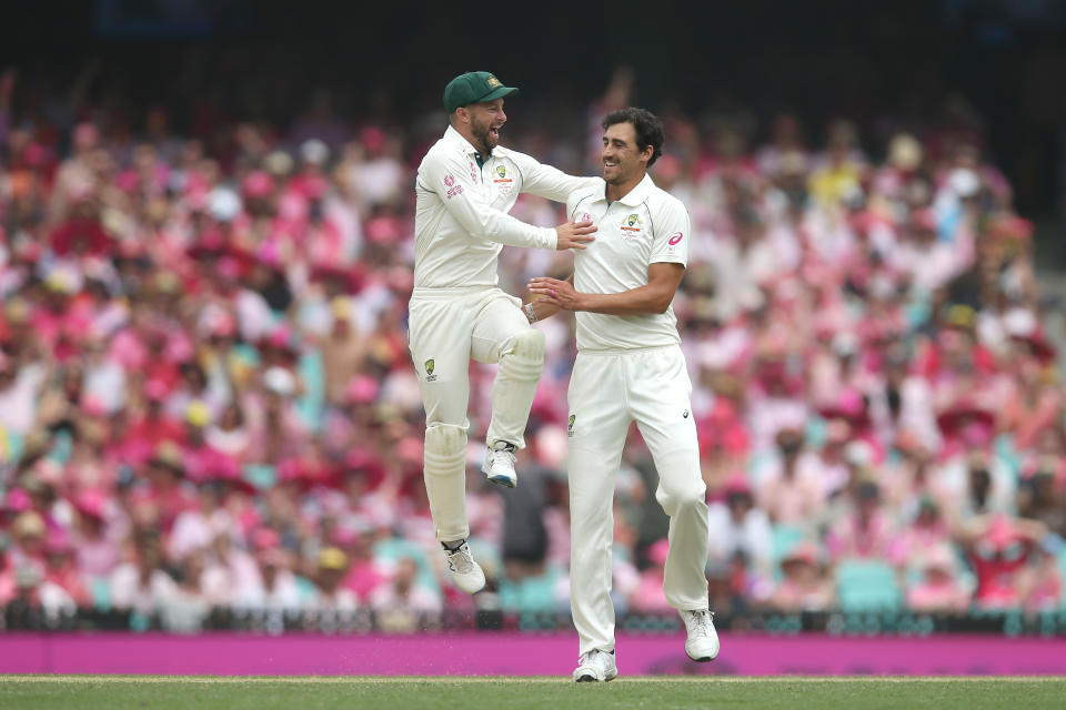 Mitchell Starc celebrates with Matthew Wade of Australia after dismissing BJ Watling of New Zealand during day three of the Third Test match in the series between Australia and New Zealand at Sydney Cricket Ground on January 05, 2020 in Sydney, Australia.