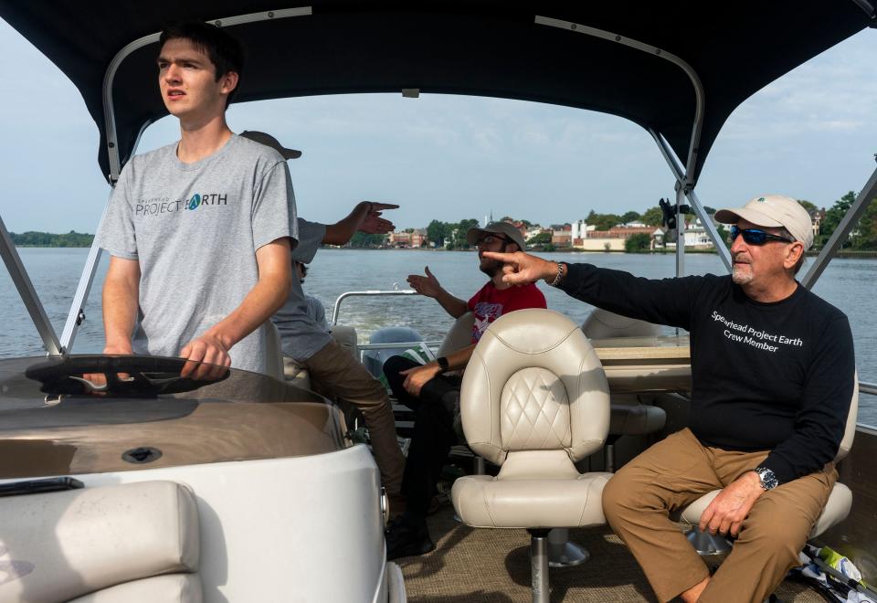 Aidan Catalano, left, from Yardley, drives Henry Matthews, from Medford, on right, and other volunteers from Spearhead Project Earth to do their weekly cleanup of Burlington Island on the Delaware River in between New Jersey and Pennsylvania on Thursday, Aug. 10, 2023.