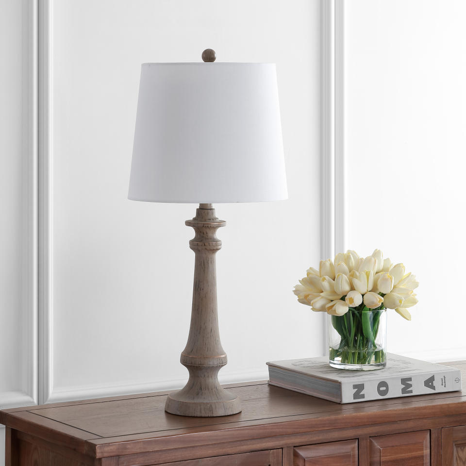 This lamp is designed to have a candlestick silhouette and antique brown finish. It's so simple that it can fit in just about anywhere. ﻿<a href="https://fave.co/2Hl9Dsk" target="_blank" rel="noopener noreferrer">Find it for $54 at Walmart</a>.