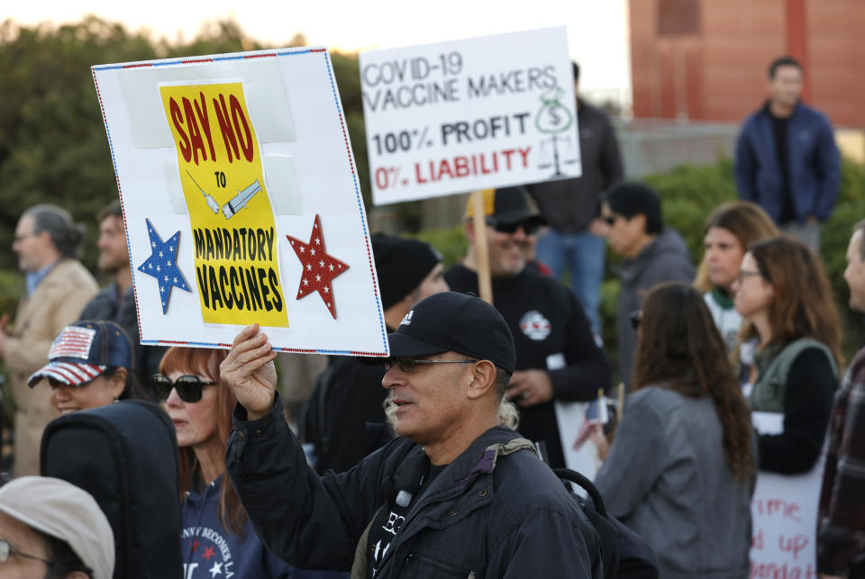 Protesters at an anti-vaccination rally