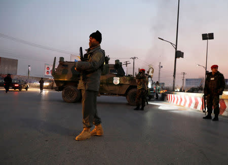 Afghan security forces stand guard at the site of an attack in Kabul, Afghanistan December 24, 2018.REUTERS/Omar Sobhani