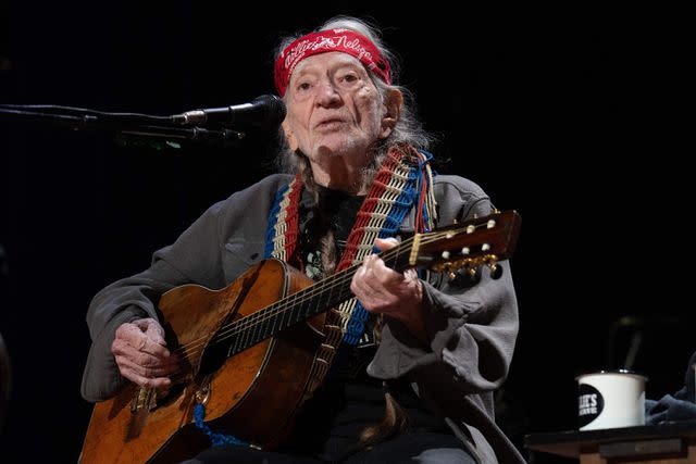 <p>SUZANNE CORDEIRO/AFP via Getty </p> Willie Nelson performs in September 2023