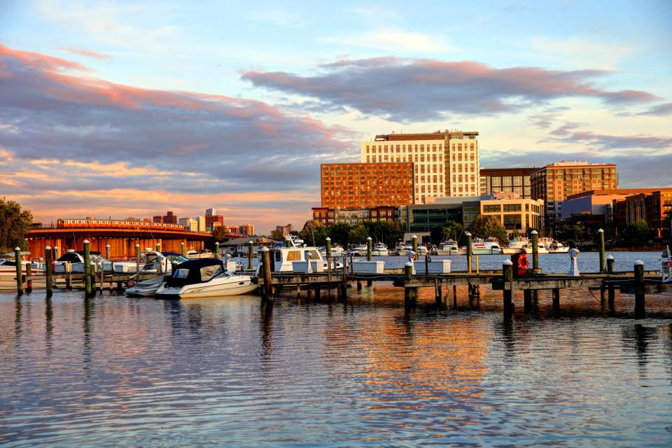 A dock in with the Somerville skyline in the background