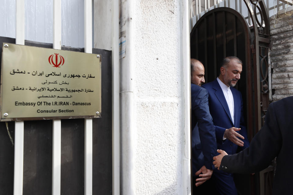 Iranian Foreign Minister Hossein Amirabdollahian, right, leaves after the opening of the new Iranian consulate building in Damascus, Syria, Monday, April 8, 2024. Iran's foreign minister Monday accused the United States of giving Israel the "green light" to strike the consulate building in Syria that killed seven Iranian military officials including two generals. (AP Photo/Omar Sanadiki)