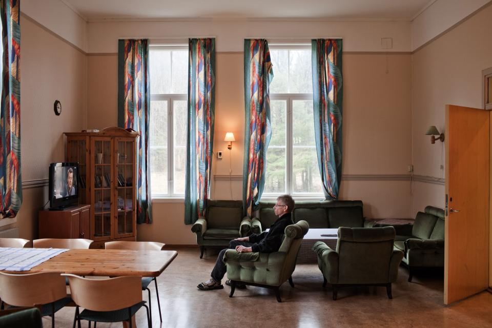 BASTOY ISLAND, HORTEN, NORWAY - APRIL 12:  Bjorn, 54-years-old sentenced to five years and a half for attempted murder is seen watching television in the leaving room of the wooden cottage where he lives in Bastoy Prison on April 12, 2011 in Bastoy Island, Horten, Norway. Bastoy Prison is a minimum security prison located on Bastoy Island, Norway, about 75 kilometers (46 mi) south of Oslo. The facility is located on a 2.6 square kilometer (1 sq mi) island and hosts 115 inmates. Arne Kvernvik Nilsen, governor of the prison, leads a staff of about 70 prison employees. Of this staff, only five employees remain on the island overnight.  Once a prison colony for young boys, the facility now is trying to become 'the first eco-human prison in the world.' Inmates are housed in wooden cottages and work the prison farm. During their free time, inmates have access to horseback riding, fishing, tennis, and cross-country skiing. (Photo by Marco Di Lauro/Reportage by Getty Images)