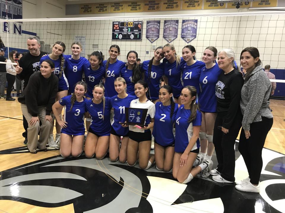 Demarest celebrates with the trophy after winning the North 1, Group 2 girls volleyball title on Tuesday, Nov. 7, 2023.