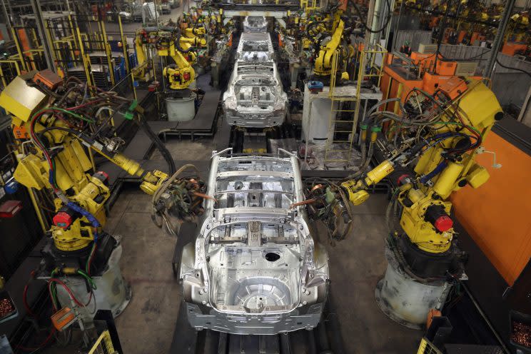 Robotic arms assemble and weld the body shell of a Nissan car on the production line at Nissan’s Sunderland plant on January 24, 2013 in Sunderland, England. (Christopher Furlong/Getty Images)