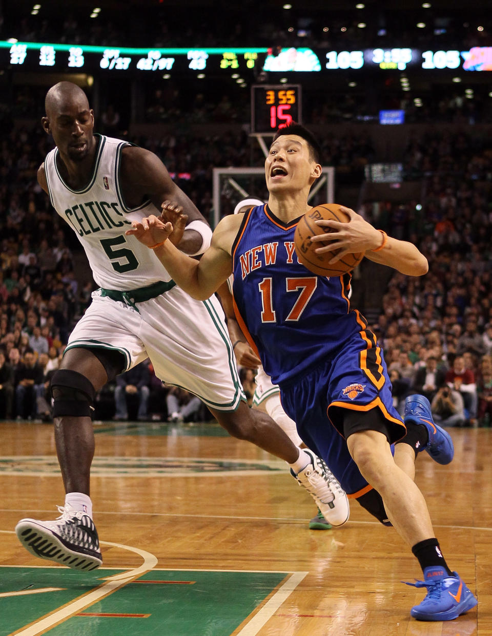 BOSTON, MA - MARCH 04: Jeremy Lin #17 of the New York Knicks drives around Kevin Garnett #5 of the Boston Celtics on March 4, 2012 at TD Garden in Boston, Massachusetts. The Boston Celtics defeated the New York Knicks 115-111 in overtime. NOTE TO USER: User expressly acknowledges and agrees that, by downloading and or using this photograph, User is consenting to the terms and conditions of the Getty Images License Agreement. (Photo by Elsa/Getty Images)