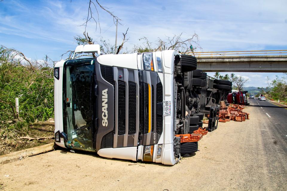 A damaged truck lies on the side of a road after hurricane Otis (Getty Images)