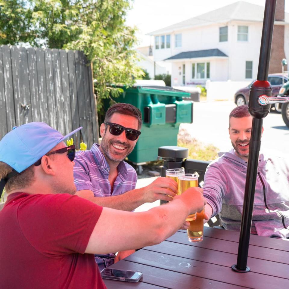 Dewey Beer Co. owners (from left) Mike Reilly, Brandon Smith and Scot Kaufman.