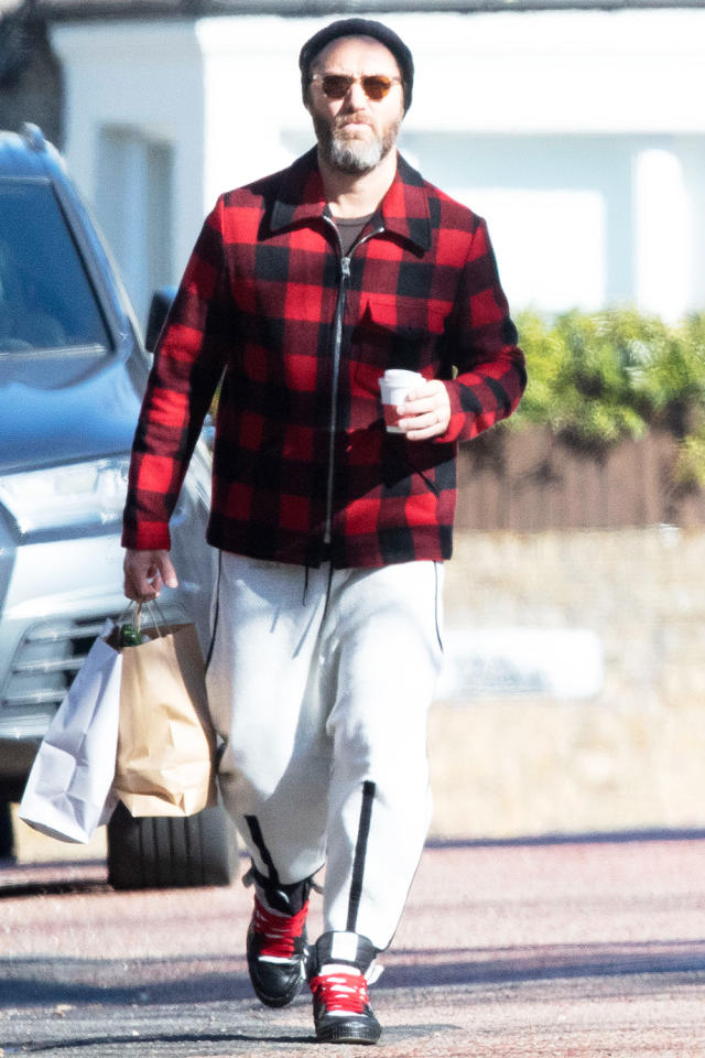 Kristen Stewart bundles up as she braves rainy weather in Los Angeles to go  for a walk with a friend