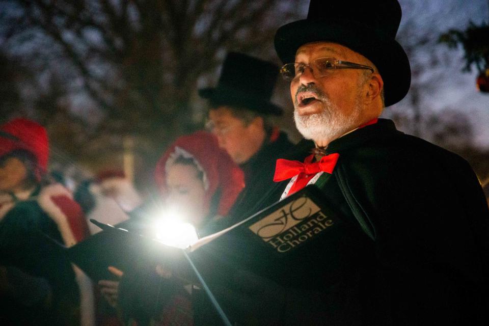 The Holland Chorale sings songs as people gather for the annual lighting of the Christmas tree Friday, Nov. 25, at Wicks Park in Saugatuck.