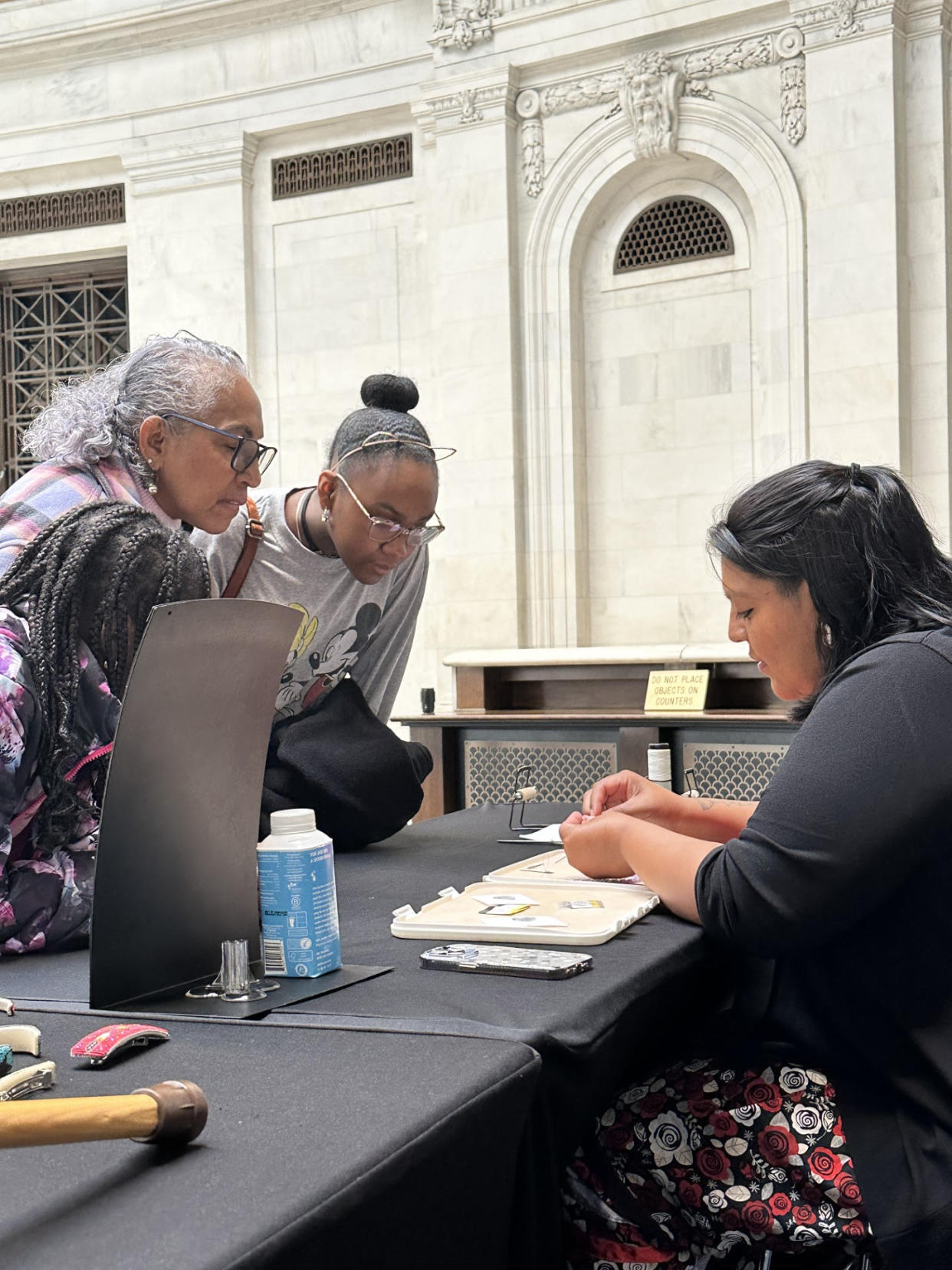 Artist Courtney Parchcorn-John demonstrates beading to patrons during the National Museum of the American Indian (NMAI) NY Women’s History Month: “Beauty of Beadwork” exhibition, recently. (Photo/Chickasaw Nation Media)