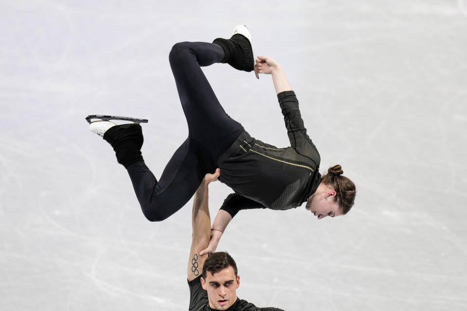 Figure skating Czech Republic athletes Jelizaveta Zukova, top, and Martin Bidar train at Capital Indoor Stadium at the 2022 Winter Olympics, Wednesday, Feb. 2, 2022, in Beijing. (AP Photo/Bernat Armangue)