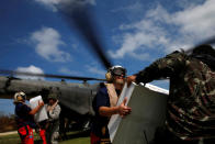 <p>Soldiers carry out relief aid after Hurricane Matthew passed through Jeremie, Haiti, October 11, 2016. (Carlos Garcia Rawlins/Reuters)</p>