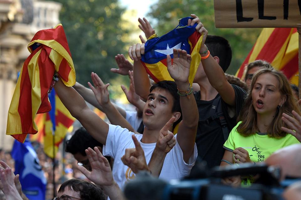 <p>Pro-referendum protestors gather in front of the Economy headquarters of Catalonia’s regional government during a police search in Barcelona on Sept. 20, 2017. (Photo: Lluis Gene/AFP/Getty Images) </p>