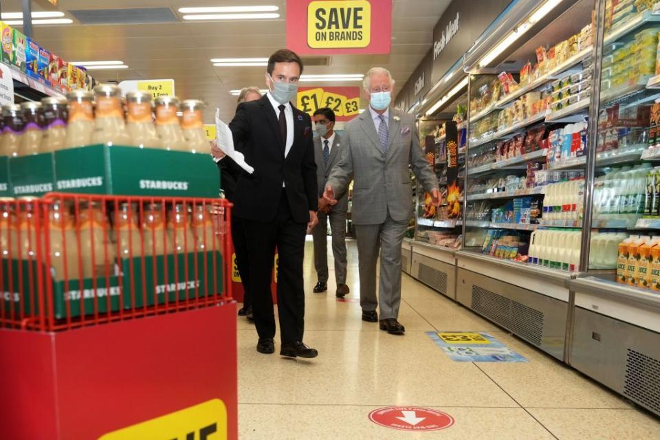 16 Photos of Queen Elizabeth, Prince Charles, and Other Royals at the Grocery Store